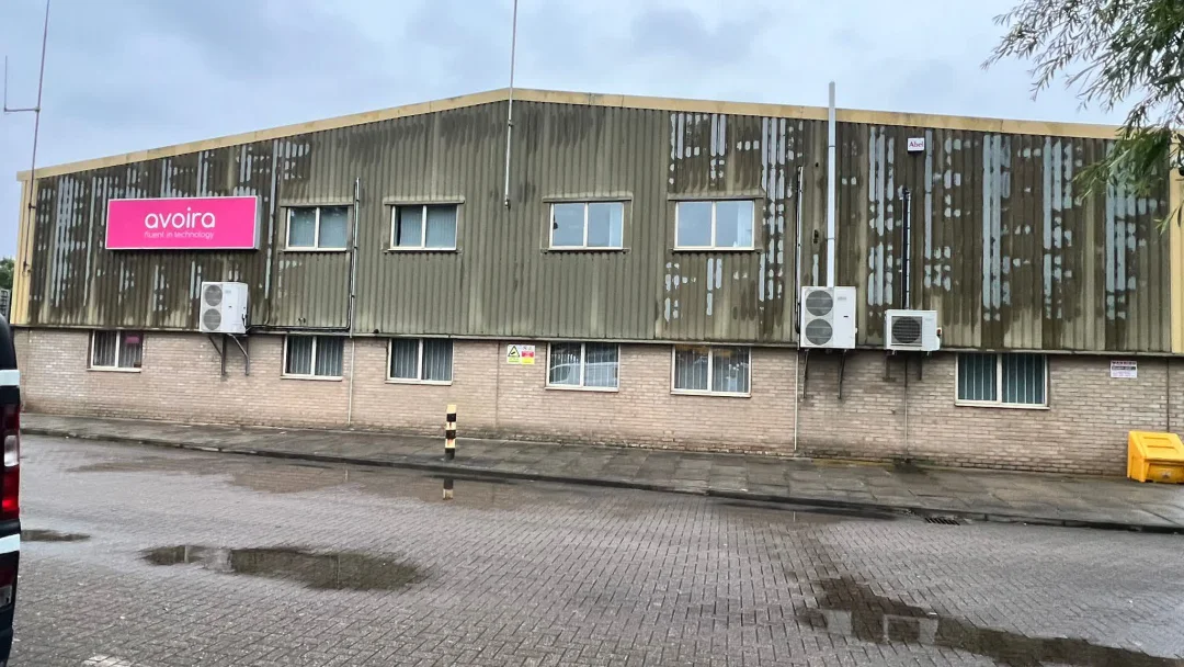 Avoira Bristol cladding before recoating, faded, chalking profiled steel panels
