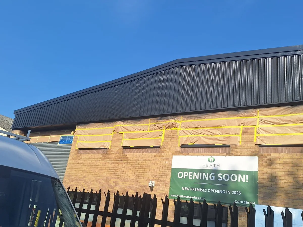 Commercial unit on Bessemer Road Cardiff with cladding masked ahead of spraying by Vanda Coatings