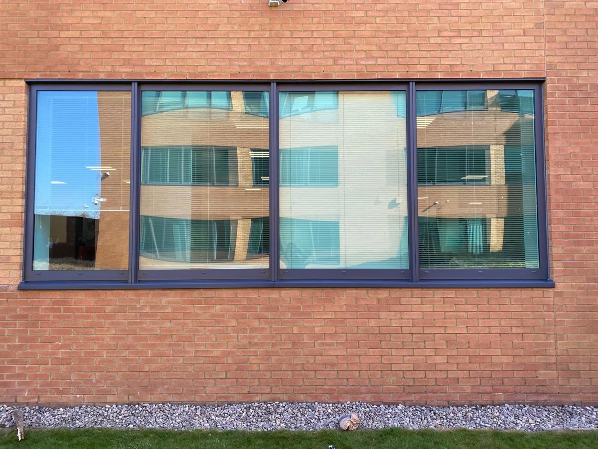 Completed ground floor window frames at Central Park Manchester, dark anthracite finish