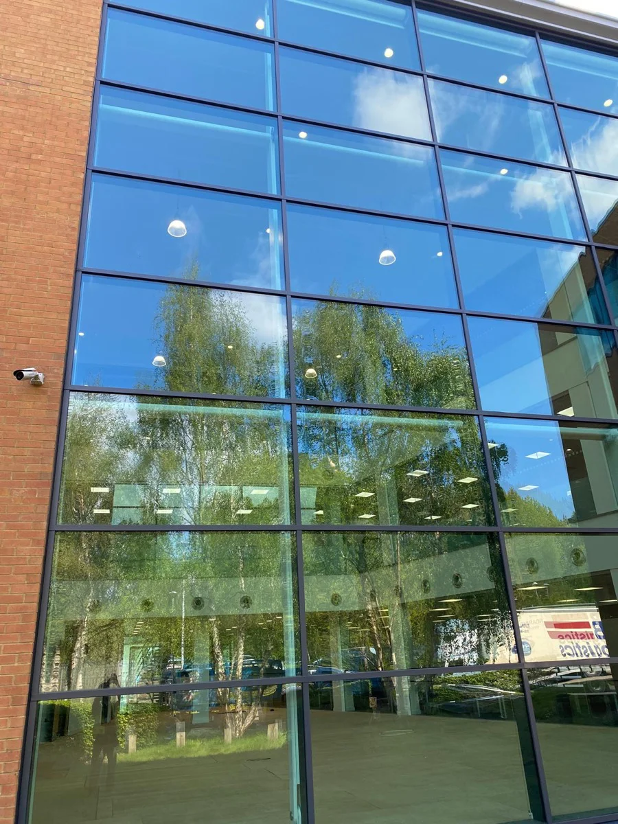 Completed large curtain wall elevation at Central Park Manchester by Vanda Coatings
