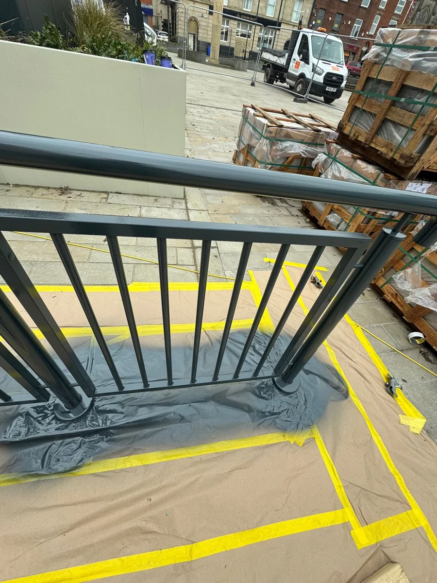 Close-up of balustrade section being sprayed at Manchester city centre development