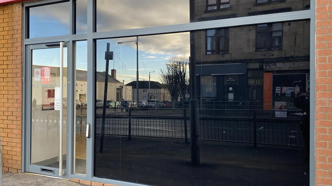 Ladbrokes Glasgow shop front after window frame recoating by Vanda Coatings, grey aluminium frames