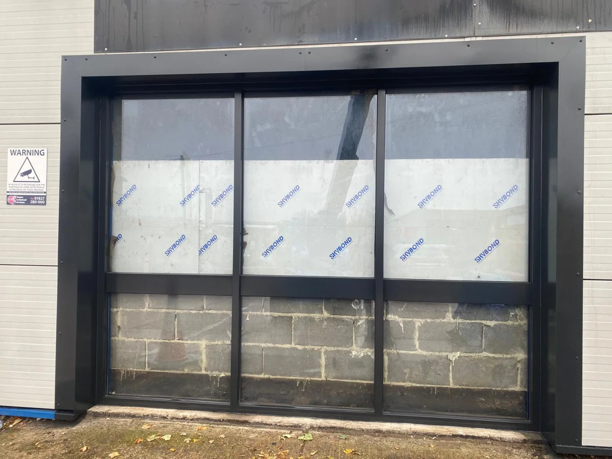 Completed dark anthracite window bay at Halfords Autocentre Strood after respraying by Vanda Coatings