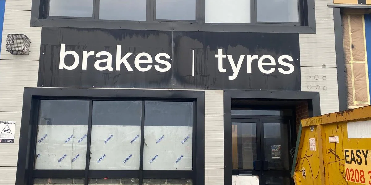 Halfords Autocentre Strood shop front after respraying by Vanda Coatings, dark anthracite finish