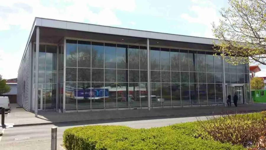 On-site spray painting of commercial aluminium window frames and shopfront