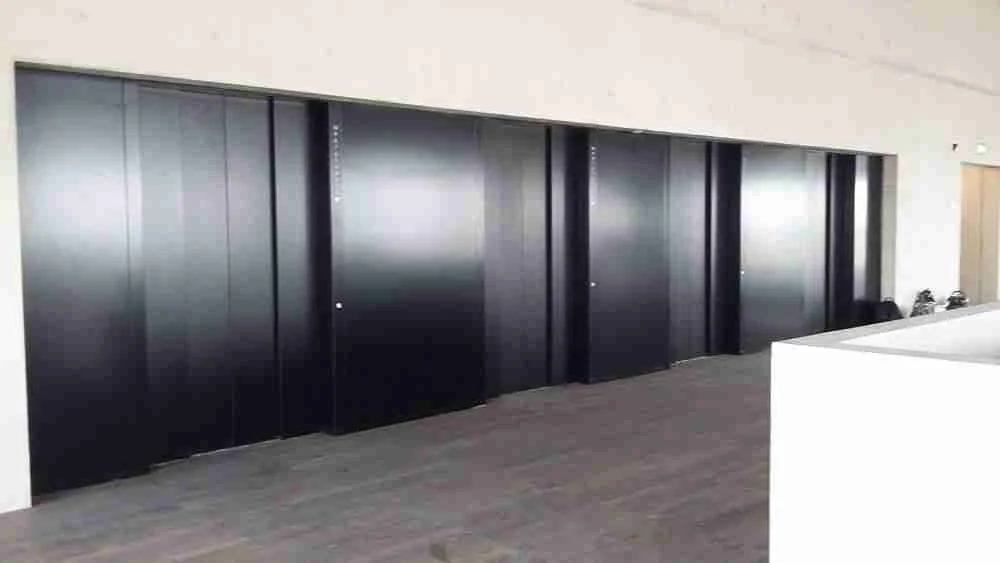 Lift landing doors recoated on site by Vanda Coatings at a Liverpool office block