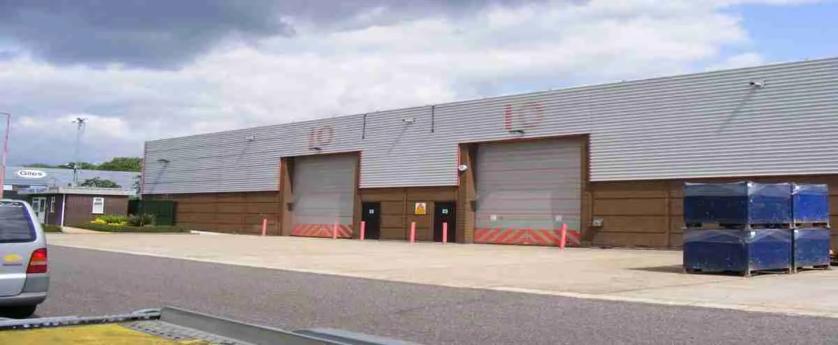 Industrial doors on a UK commercial premises awaiting spray painting and recoating