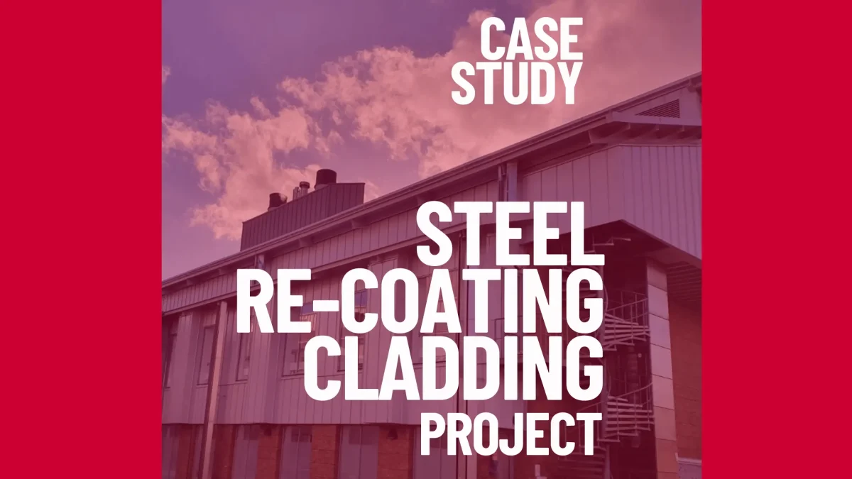 Plastisol cladding being recoated on a commercial industrial building