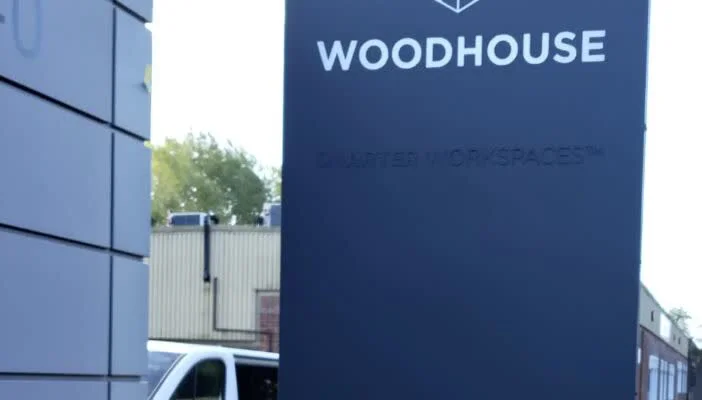 Woodhouse signage totem freshly sprayed in navy by Vanda Coatings