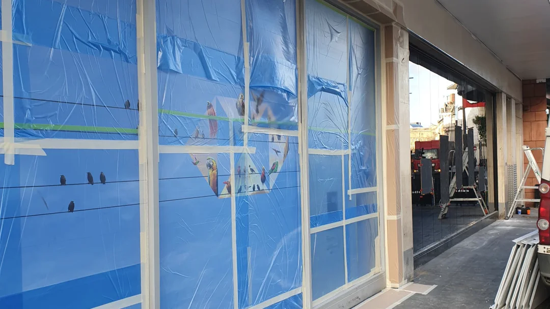 HSBC Liverpool shop front frames fully masked with polythene sheeting and tape, ready for recoating by Vanda Coatings