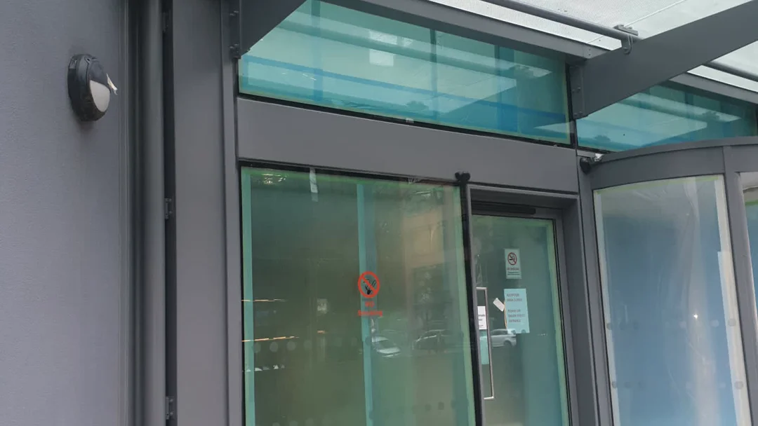 Liverpool Passport Office entrance after metalwork recoating by Vanda Coatings, dark charcoal frames and canopy steelwork