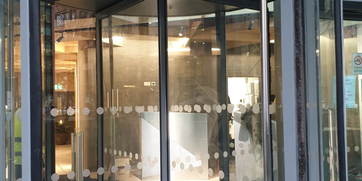Liverpool Passport Office revolving door entrance after metalwork recoating by Vanda Coatings