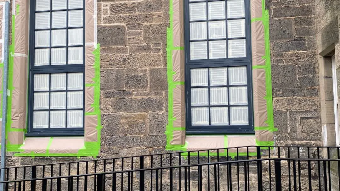 Shop front frames masked and prepared for spraying at Loretta Edinburgh