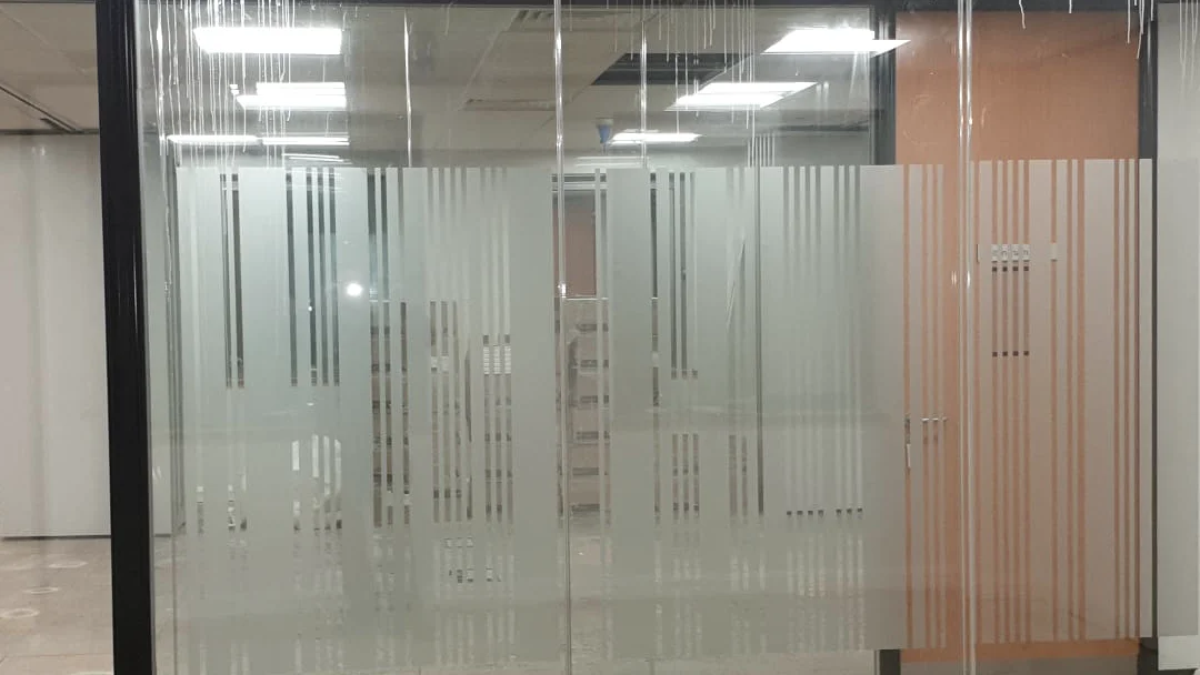 Vanda Coatings operatives applying spray coating to office interior surfaces in London