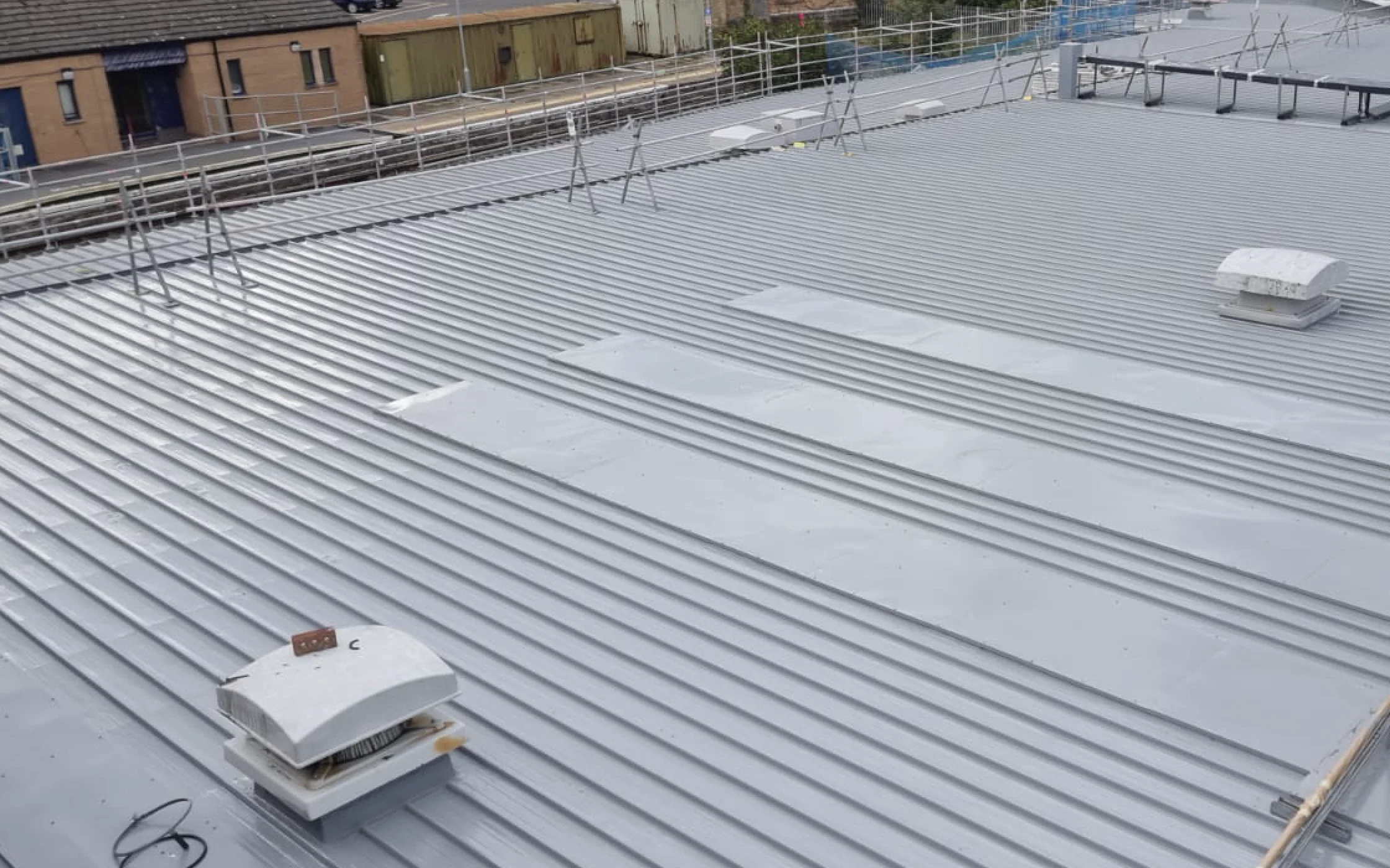 Industrial roof recoating in progress by Vanda Coatings