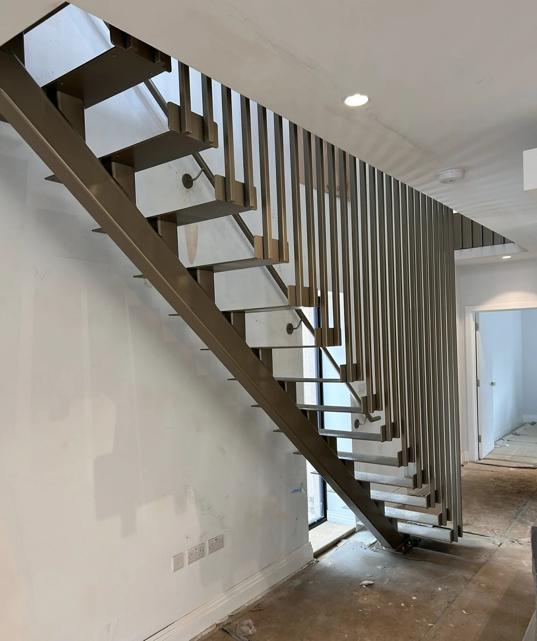 Commercial staircase balustrades and handrails re-coated by Vanda Coatings